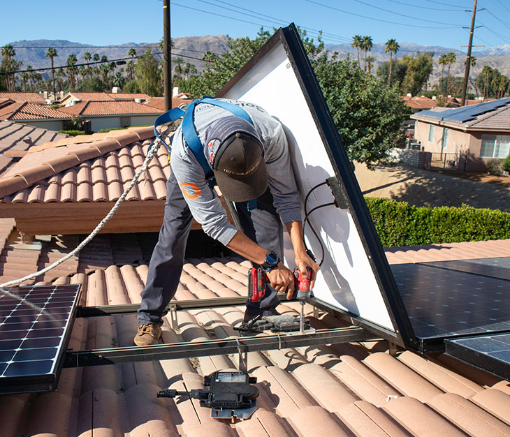 Renovian Solar Panel Installer Working On A Residential Solar Installation