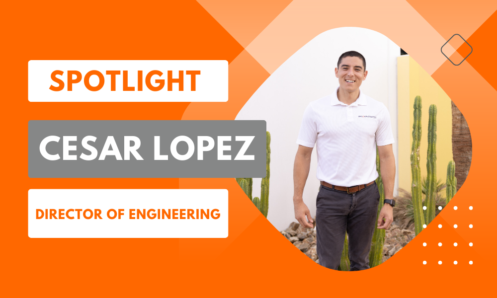 An individual in a white polo and dark pants smiles while standing near tall cacti, set against a modern building. The image includes bold text that reads Spotlight: Cesar Lopez, Director of Engineering on an orange and white geometric background.