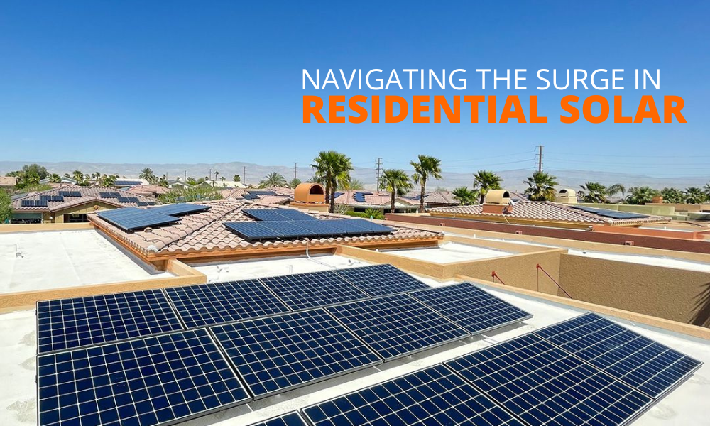 Rooftop view of suburban homes with solar panels under a clear blue sky. Text on the image reads: Navigating the Surge in Residential Solar in white and orange letters. Palm trees are visible in the background, suggesting a sunny and arid climate.