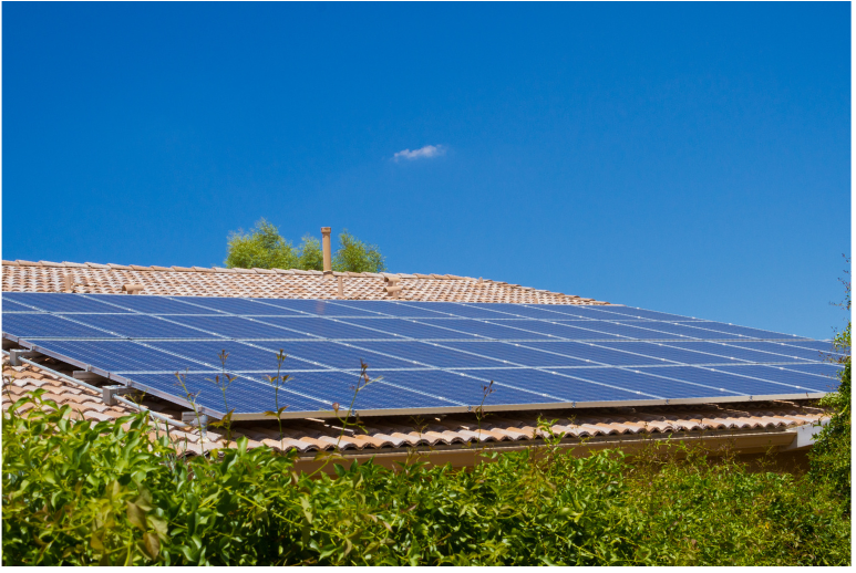 solar panels on a roof of a brown house