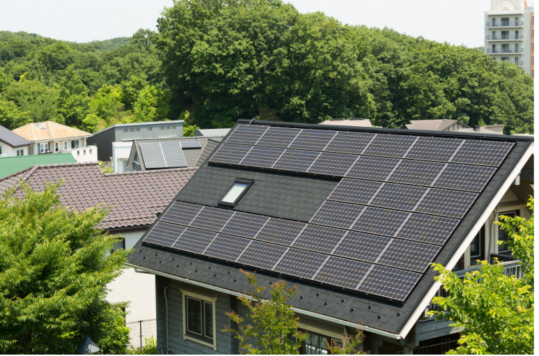 solar panels on a roof of a house in a city