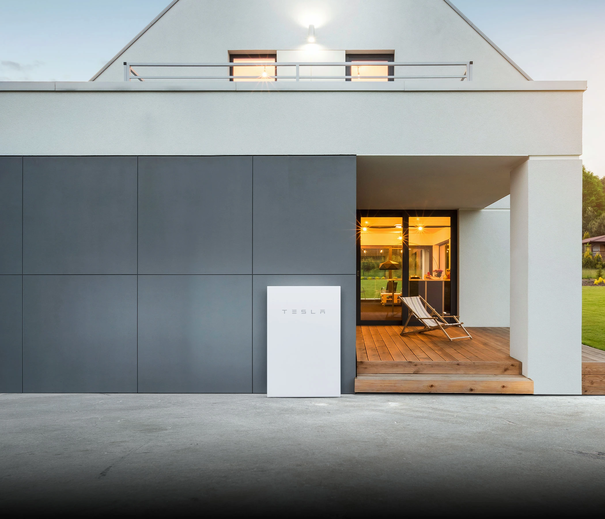 tesla power wall EV charge station on the side of a house
