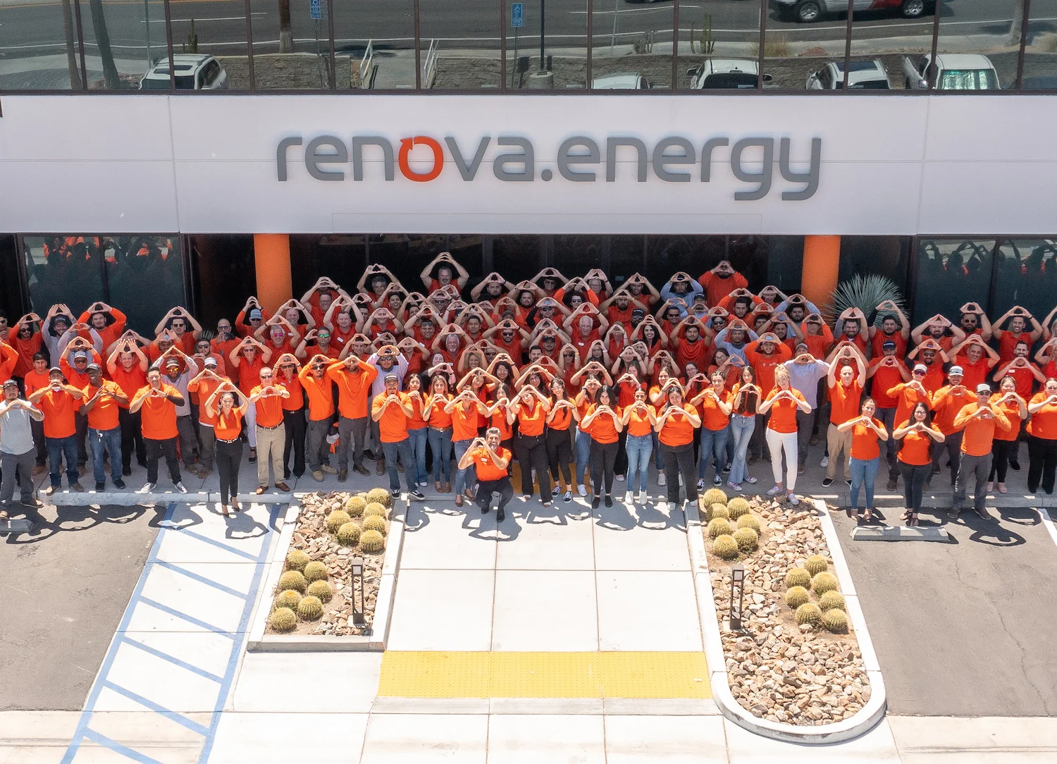 Renova Employees all in a group photo in front of the home offices