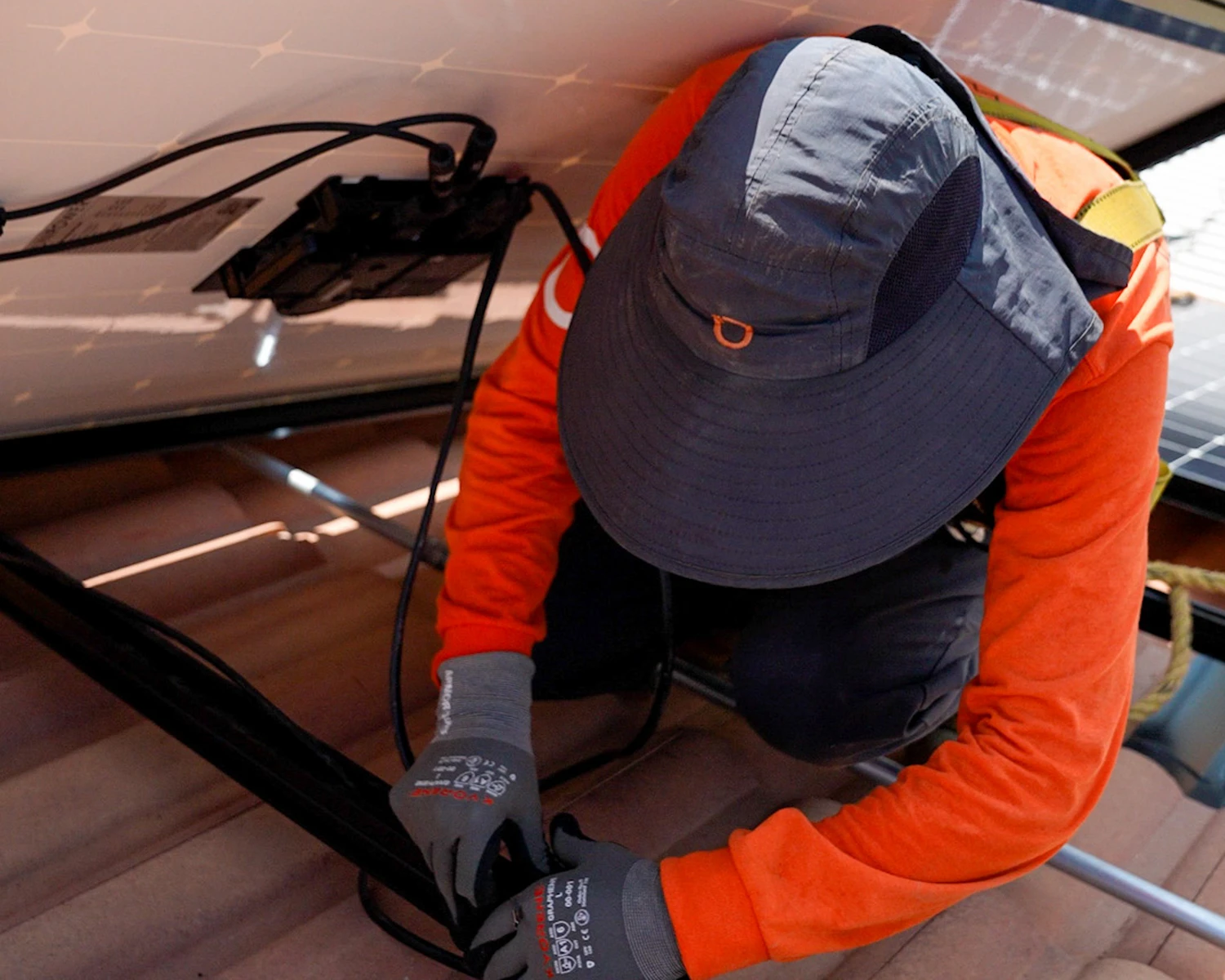 solar panel technician working on connecting wires