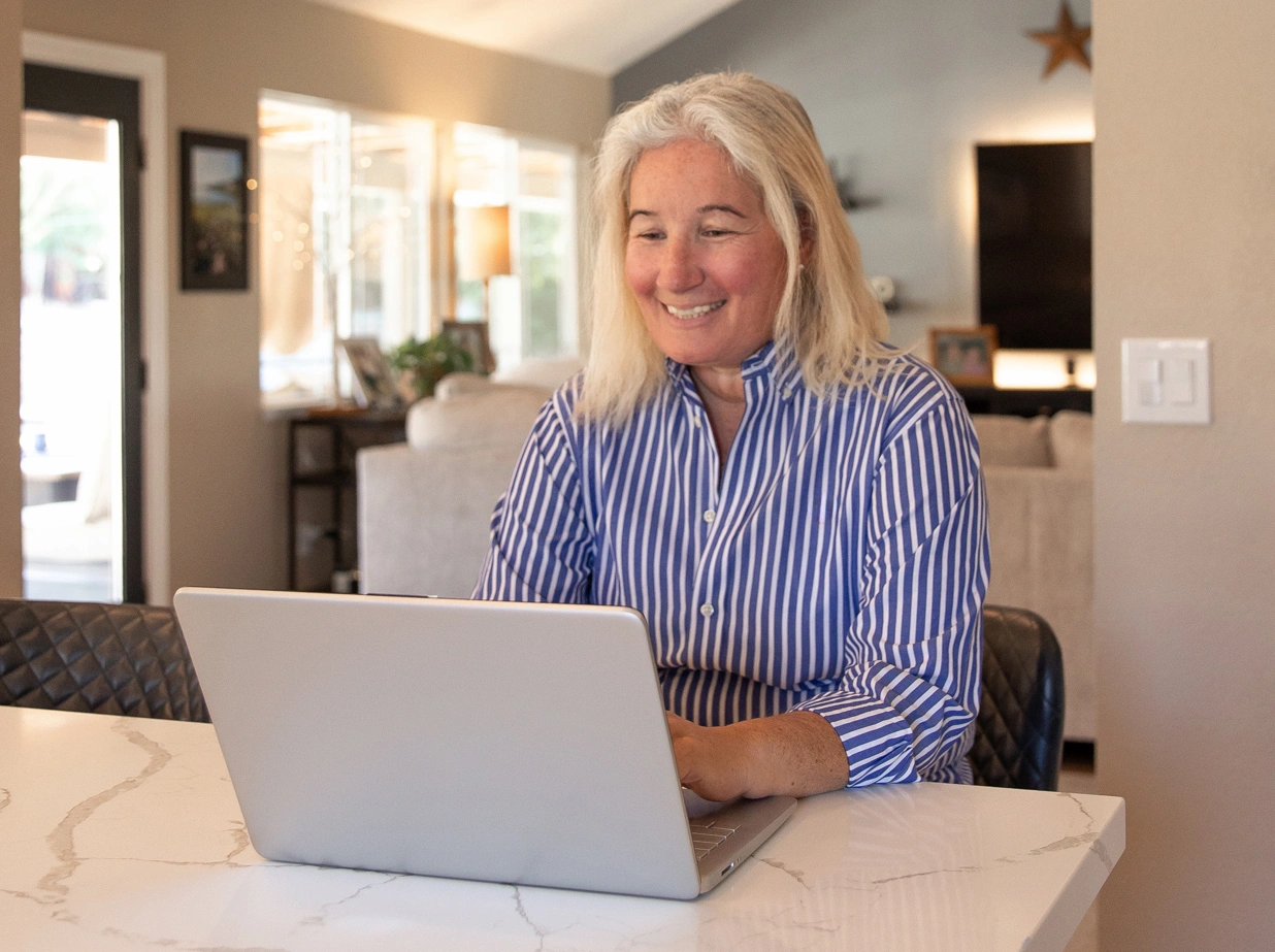 woman looking at her laptop