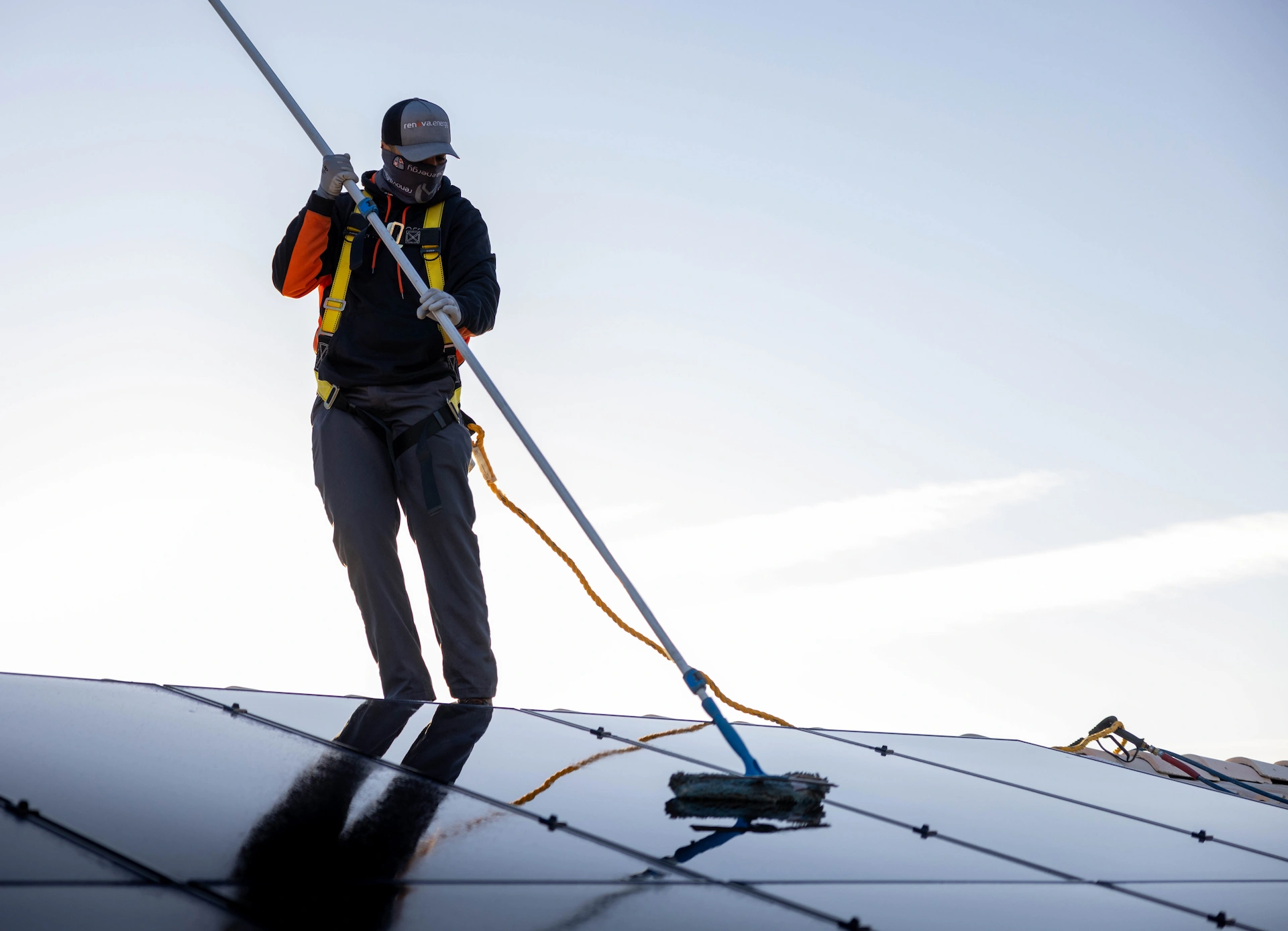 solar panel maintenance technician cleaning the solar panel array