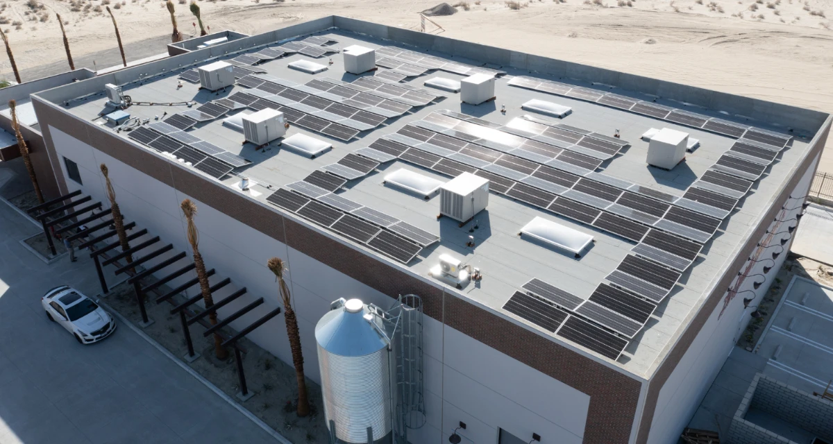 birds eye view of La Quinta Brewing Co. with solar panels on the roof