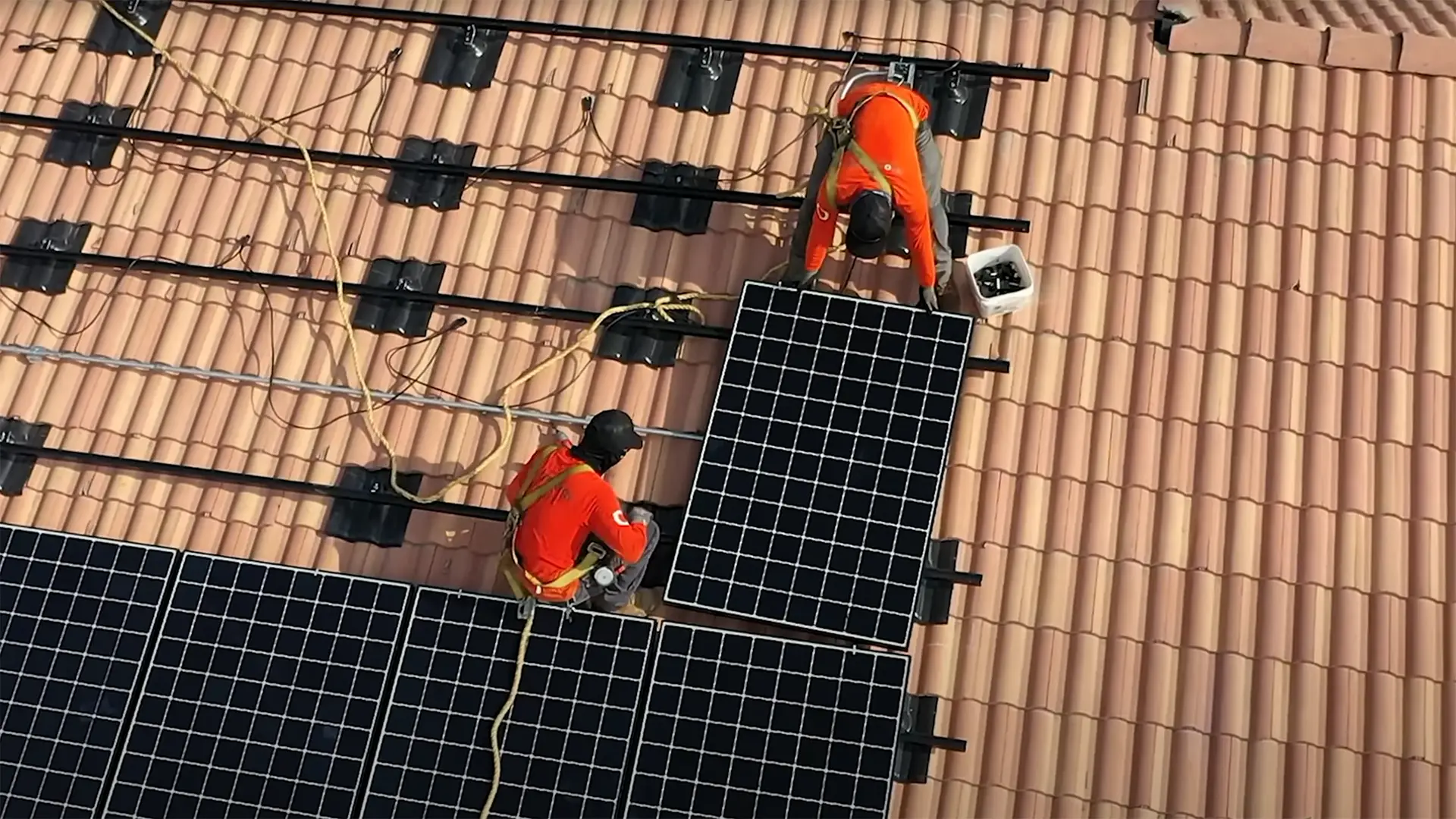 renova-careers-video-featured-1 solar technicians installing solar panels on a roof in the southwest