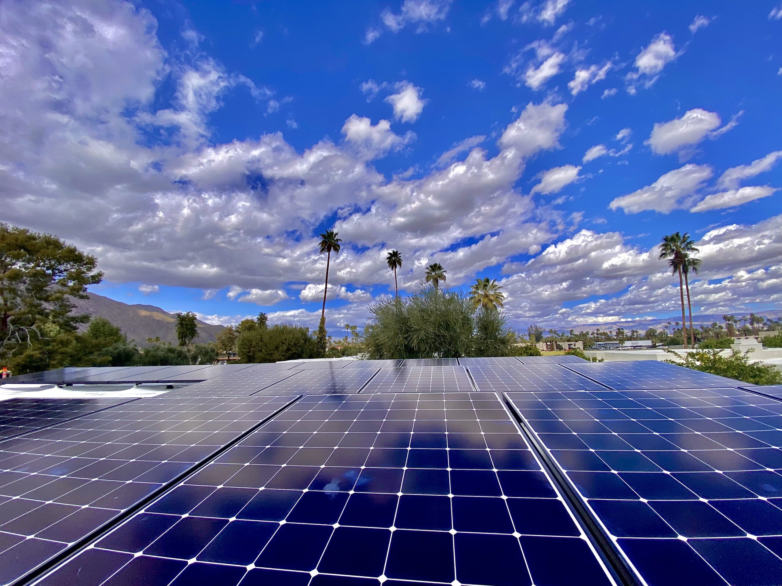 California Solar Panel installers finished work. A close up view of solar panels with the sky in the background 